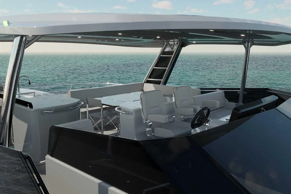 Luxury yacht cockpit with modern seating, dining area, and ocean view under a stylish canopy.